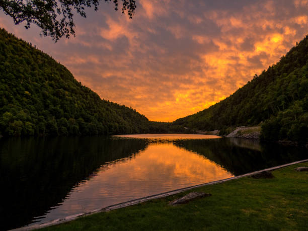istock Pond with mountains in the sunset 1345012627