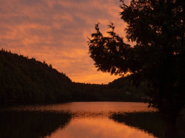 istock Pond with mountains in the sunset 1345012655