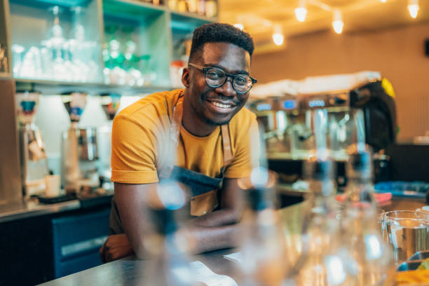 istock Portrait of happy bartender 1345012856