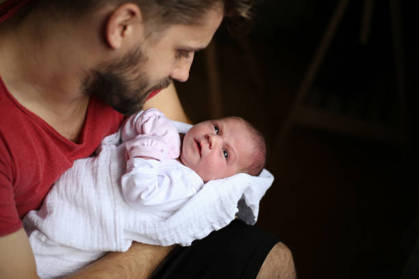 istock Newborn with Father stock photo 1345014696