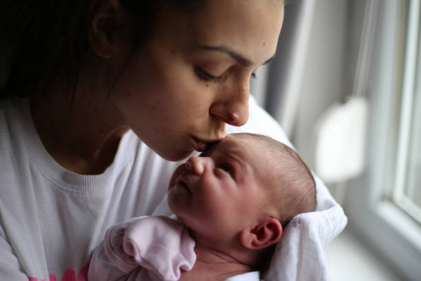 Shot of a mother and her newborn baby at home