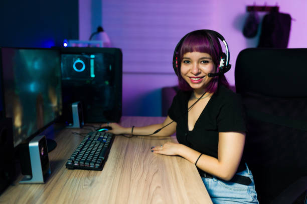 istock Beautiful woman sitting at her computer 1345016099