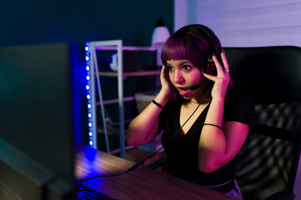 istock Surprised woman winning on a video game 1345016150