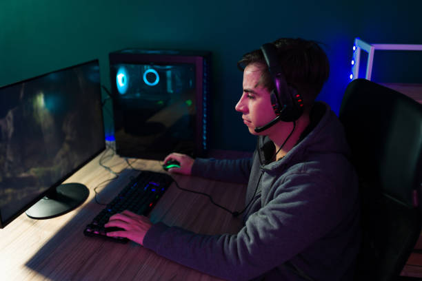 istock Attractive man enjoying gaming 1345016919