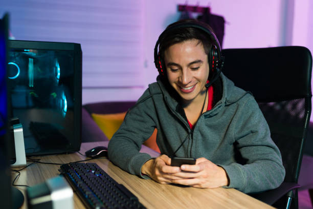 istock Cheerful gamer checking social media 1345017050
