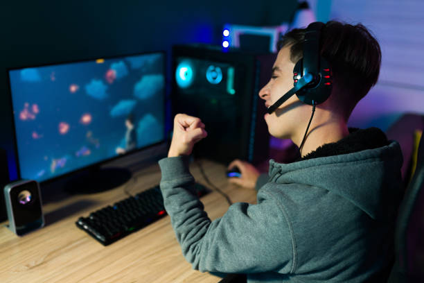 istock Yes! Gamer cheering after his victory 1345017066