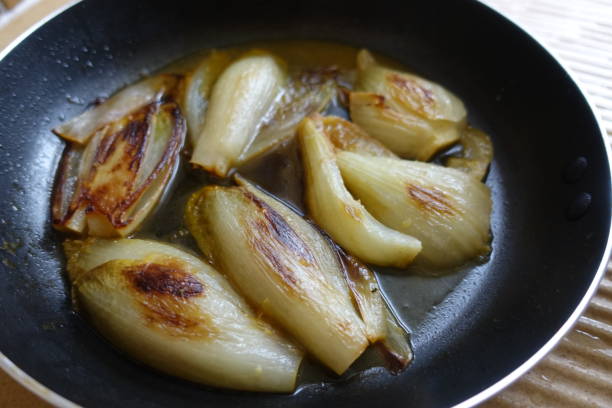 istock Fennel and endives  fried in a frying pan 1345017233