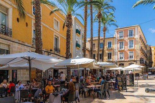 August, 2021. Alicante, Spain. Various people enjoying a summer day at lunch time.