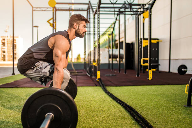 istock Young bodybuilder doing a deadlift at the outdoor gym. 1345019431