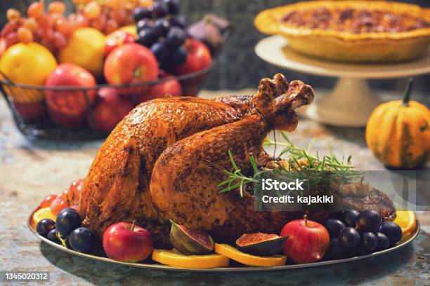 Preparing Stuffed Turkey With Side Dishes For Holidays Stock Photo - Download Image Now
