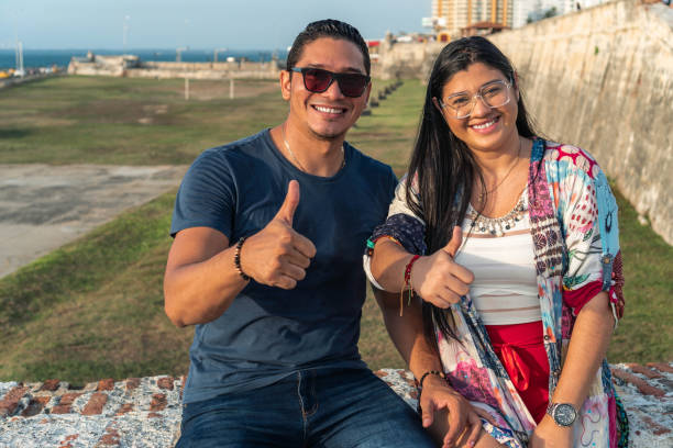 istock Couple looking at camera in the open air 1345020704