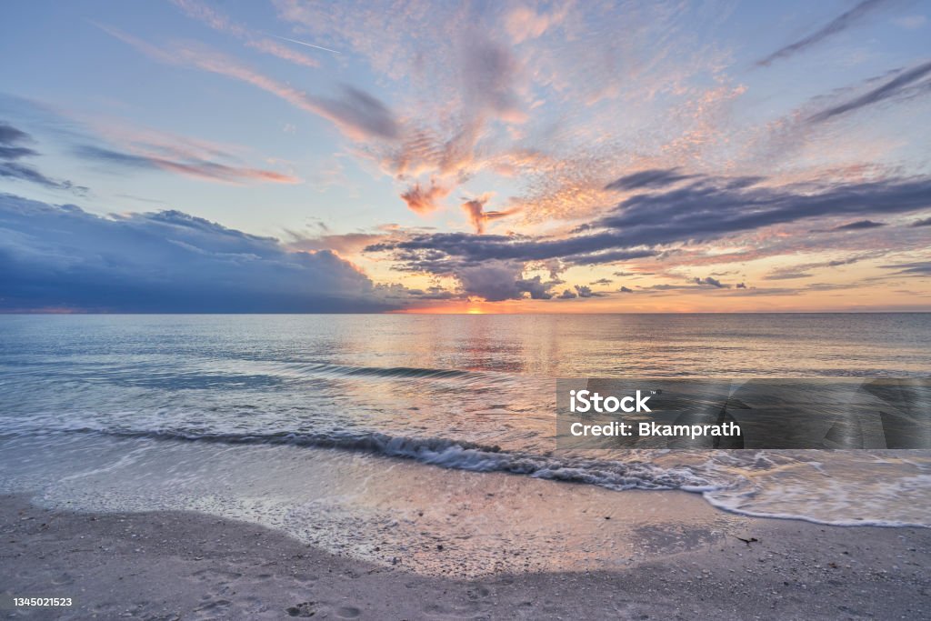 Vibrant Sunset at Sand Key Beach in Clearwater Florida USA Vibrant sunset at Sand Key Beach in Clearwater Florida USA Clearwater - Florida Stock Photo