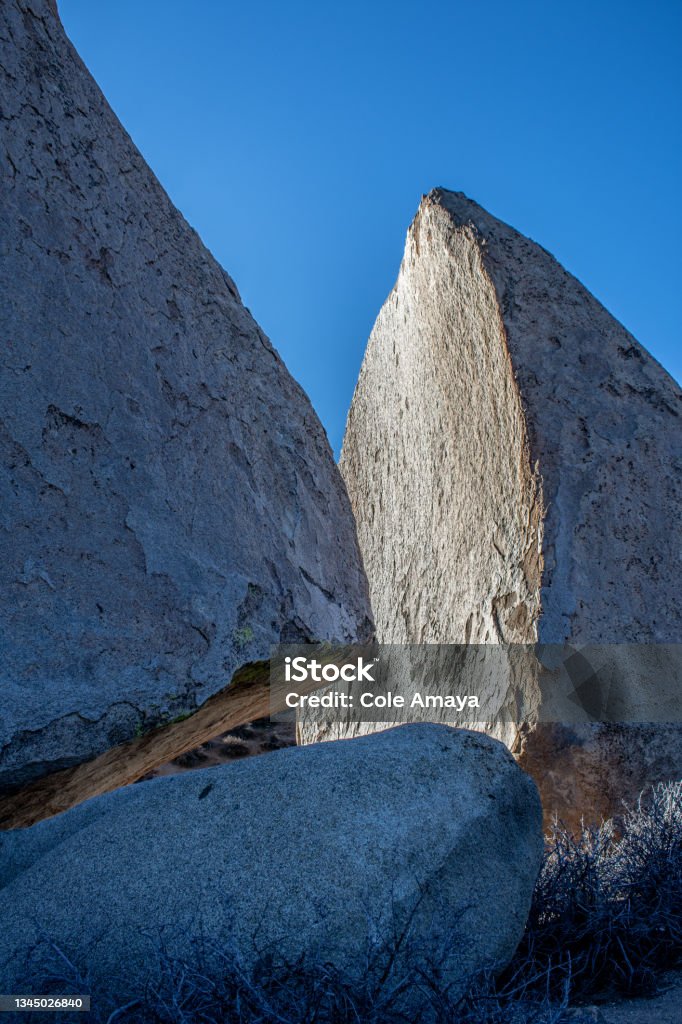 Buttermilk Boulders An image of one of the Buttermilk Boulders in Bishop, California with a mountain in the background. Bishop - California Stock Photo