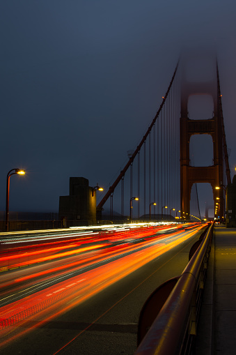 A long exposure image taken from the east walkway of the Golden Gate Bridge at Night. In San Francisco, California.