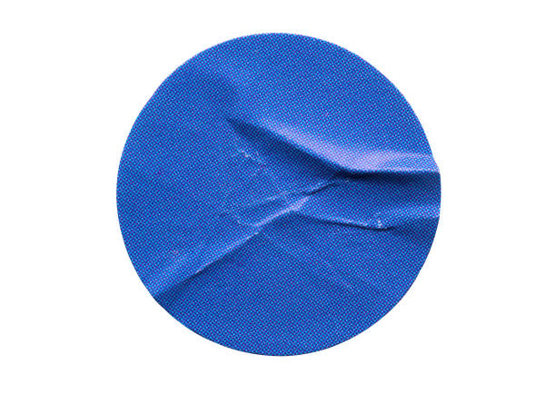 istock Blank blue round adhesive paper sticker label isolated on white background 1345030841