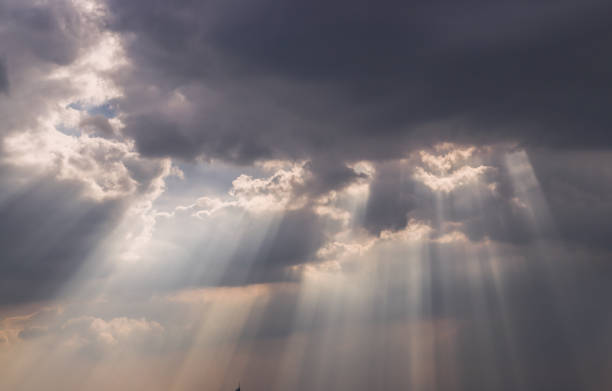 istock The sun's rays passing through the clouds and shining. 1345031017
