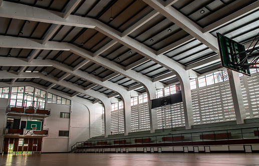 Bangkok, Thailand - Oct 04, 2020 : Empty basketball gym. Interior of a basketball hall. Copy space, Selective focus.