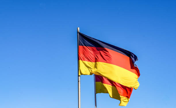 istock Two German national flags in the wind. 1345034001