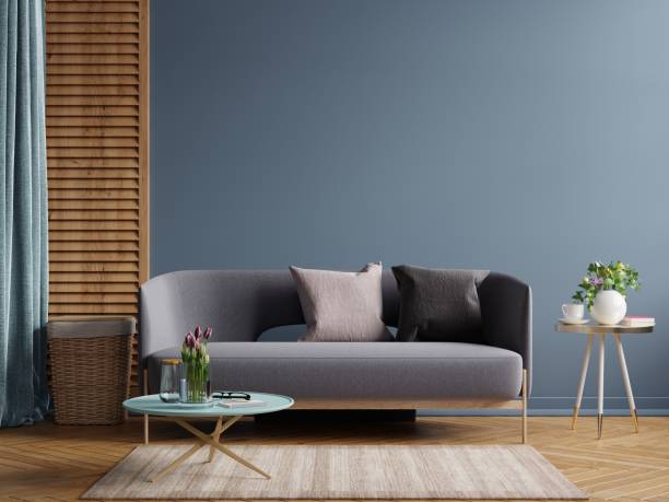 istock Dark modern interior design mockup with sofa on empty dark blue wall background. 1345040392