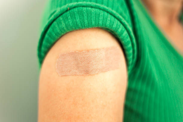 istock Post-Vaccination Bandage on Woman's Arm 1345042716