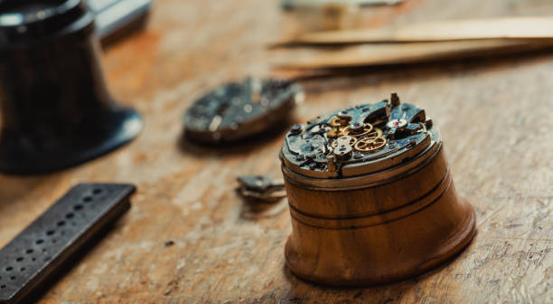 istock Watch mechanism mounted on a stand for repairs 1345043655