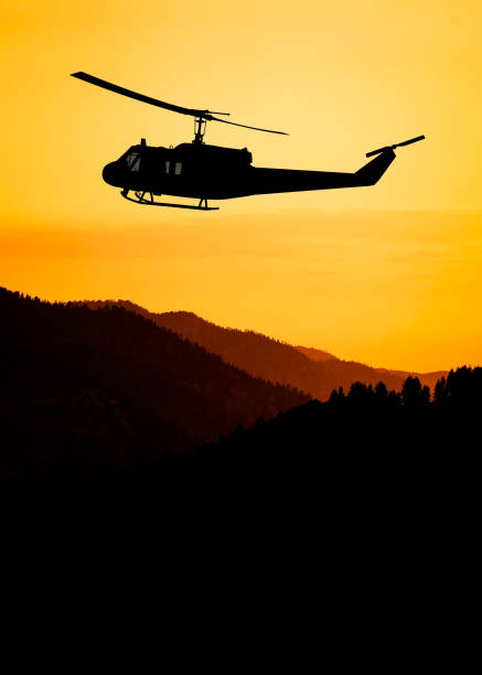 istock American utility military helicopter in the flight 1345045305