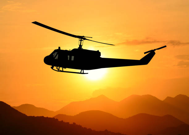 istock American utility military helicopter in the flight 1345045309