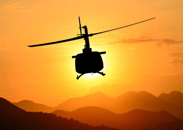 istock American utility military helicopter in the flight 1345045310