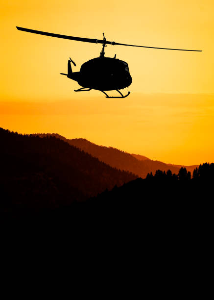 istock American utility military helicopter in the flight 1345045311