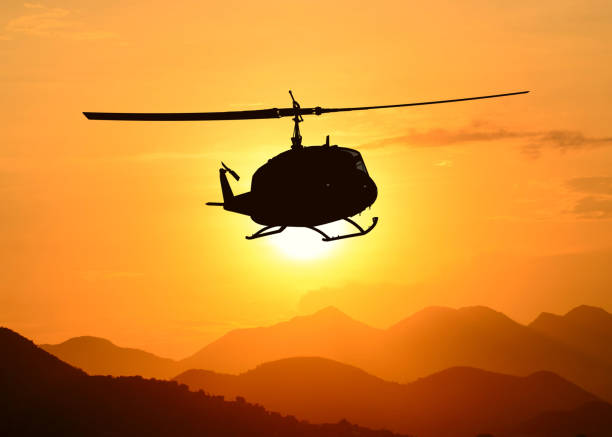 istock American utility military helicopter in the flight 1345045312
