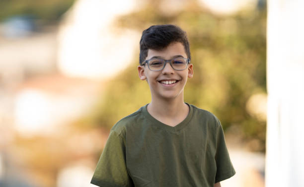 istock Portrait smiling boy outdoors 1345052929