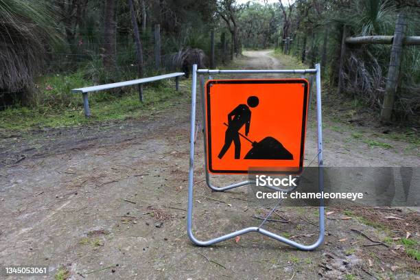 Road Work Sign On A Public Park Path Stock Photo - Download Image Now - Construction Worker, Footpath, Australia