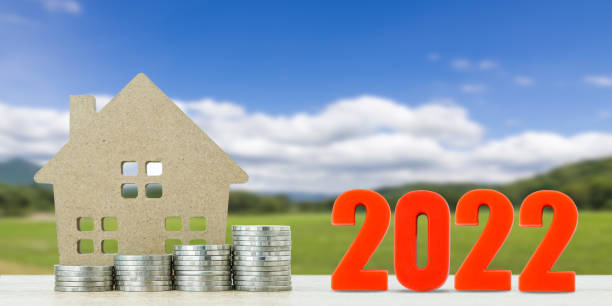 istock House model and stack of coins with landscape 1345053740