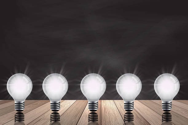 istock Light bulb on wood background , Idea innovation and inspiration concept, new technology in the future,  brainstorming, and education concepts 1345055232