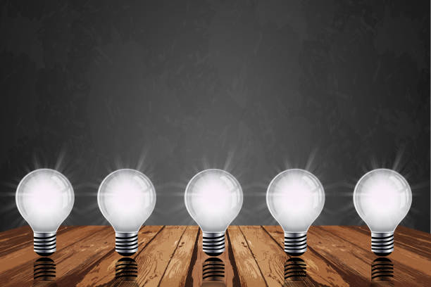 istock Light bulb on wood background , Idea innovation and inspiration concept, new technology in the future,  brainstorming, and education concepts 1345055235