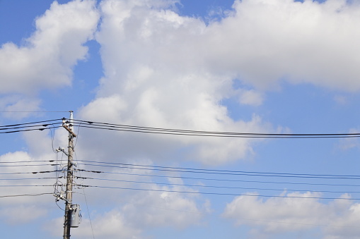 I took this picture of a telegraph pole under a blue sky. It will be used for city and electricity related photos.