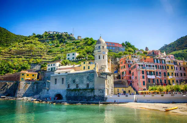Colorful harbor and tower in beach Vernazza, Cinque Terre, Italy