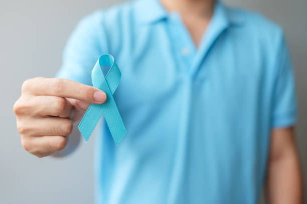 November Prostate Cancer Awareness month, Man in blue shirt with hand holding Blue Ribbon for supporting people living and illness. Healthcare, International men, Father and World cancer day concept November Prostate Cancer Awareness month, Man in blue shirt with hand holding Blue Ribbon for supporting people living and illness. Healthcare, International men, Father and World cancer day concept prostate gland stock pictures, royalty-free photos & images