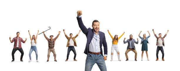 istock Cheerful young man gesturing happiness and other people behind raising arms 1345071430