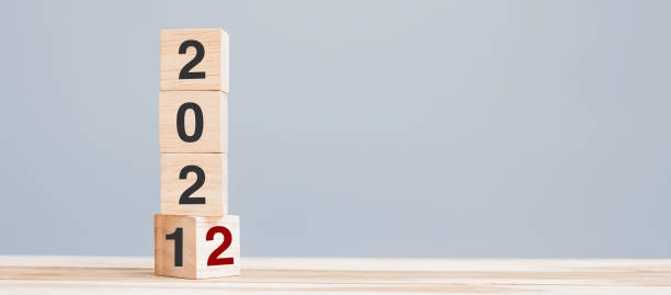 istock 2022 wooden cube blocks on table background. Resolution, plan, review, goal, start and New Year holiday concepts 1345071624