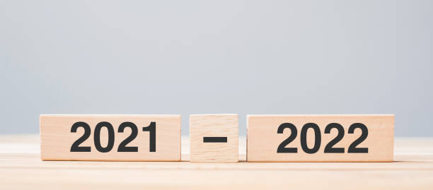 istock 2021 and 2022 wooden block on table background. Resolution, strategy, countdown, goal, change and New Year holiday concepts 1345071765