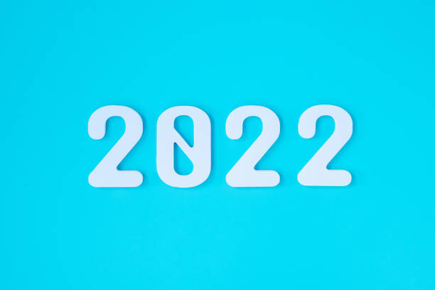 istock 2022 white text number on blue background. Resolution, plan, review, goal, start and New Year holiday concepts 1345071945