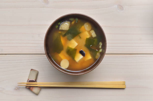 a bowl of rice and miso soup on the table/top angle