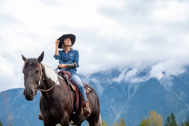 istock Woman riding her horse 1345073307