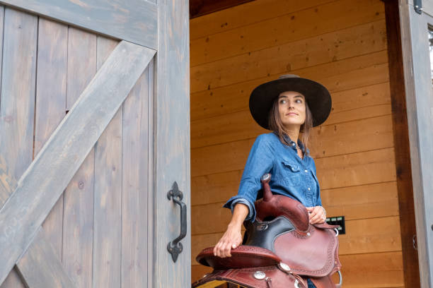istock male rancher in a tacking room 1345074123