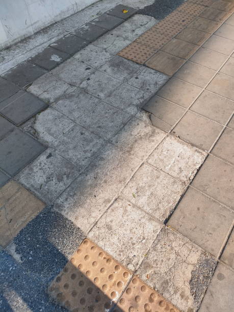 istock Crack brick block in pavement. 1345074226
