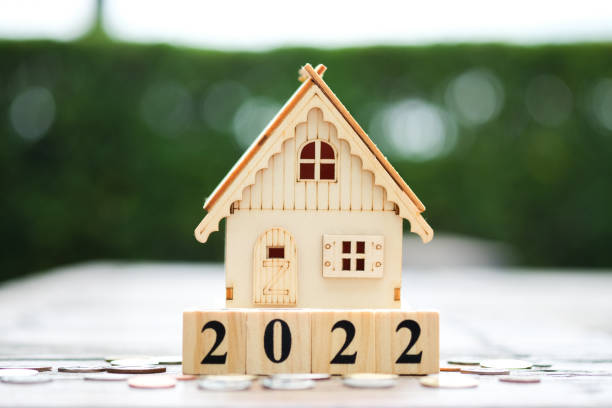 istock 2022 wooden block number with House model 1345075439