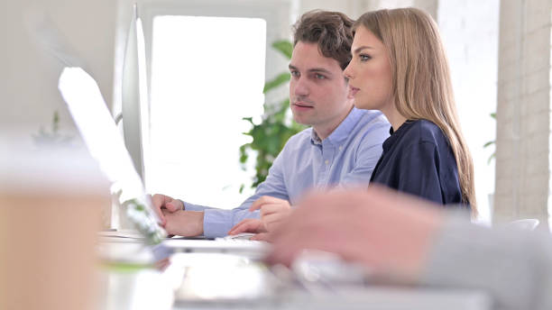 istock Close up of Creative People Discussing and Working on Desktop 1345076448