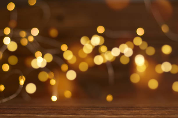 istock blurred brown background with golden bokeh for christmas 1345077911