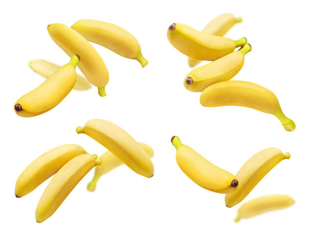 Collection of flying bananas on white